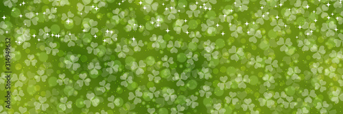 St.Patrick's Day green vector background with clover leaves