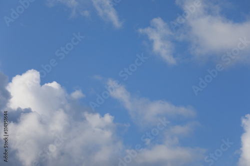 Blue sky background with clouds.  © MagioreStockStudio