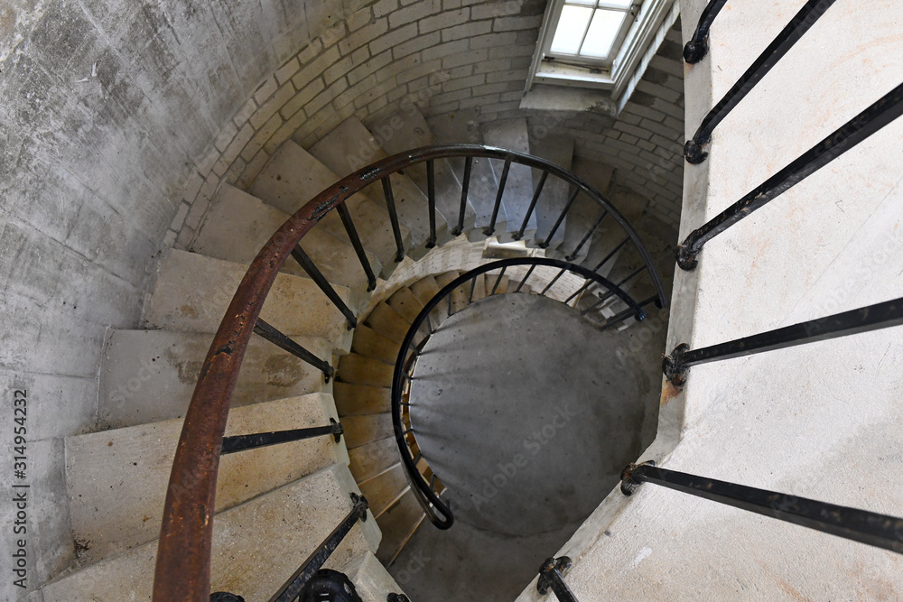 Circular staircase and railing inside lighthouse
