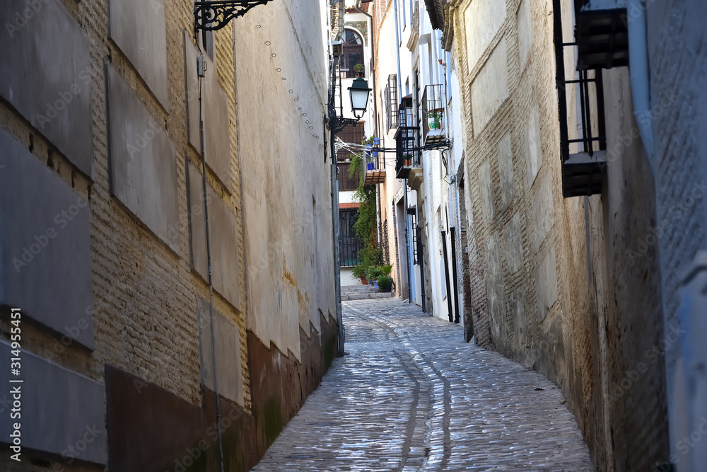 Typical narrow street in the Granada neighborhood of Albaicin