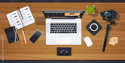 blogger or video editor workplace laptop with interface of application for editing blogging concept professional digital camera for recording desktop top angle view horizontal vector illustration