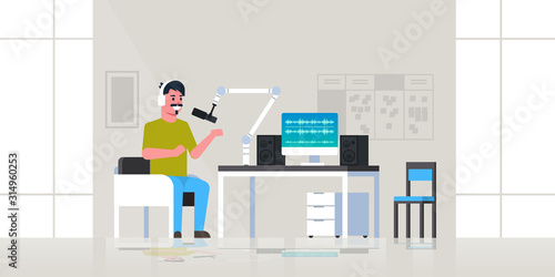 young man recording podcast in studio podcasting broadcasting online radio concept guy wearing headphones talking to microphone full length flat horizontal vector illustration