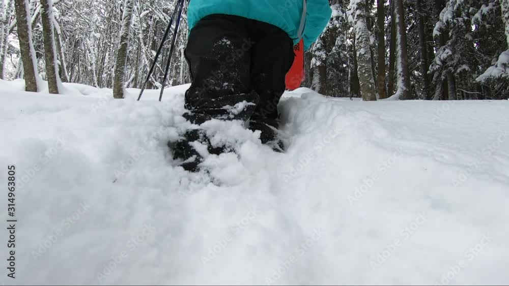 Skier walking on deep snow - Close up to the ski boots Skier walking on deep snow - Close up to the ski boots
