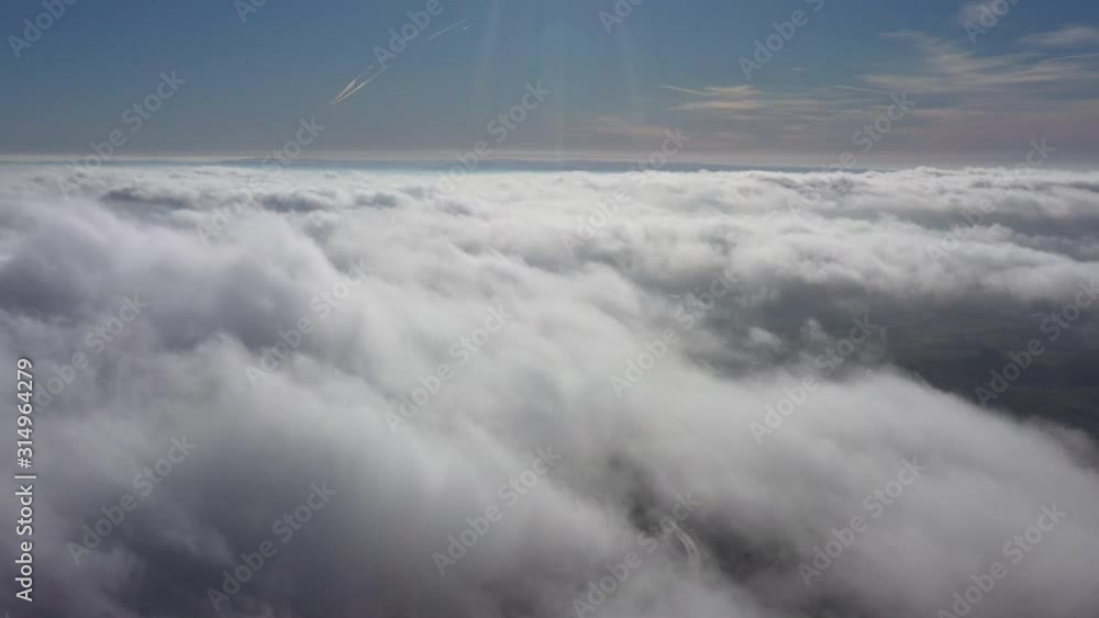 Above clouds moving fast windy day sunny blue sky France Above clouds moving fast windy day sunny blue sky France