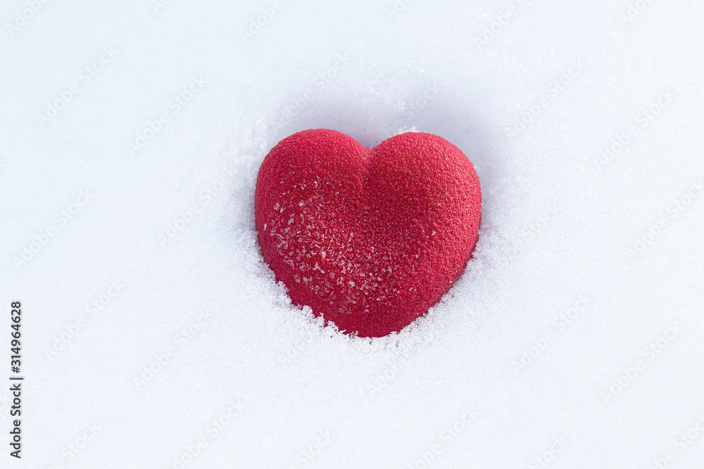 Red heart on the snow. Valentines day concept Red heart on the snow. Valentines day concept