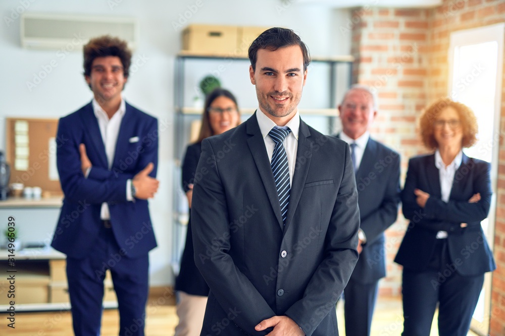 Group of business workers smiling happy and confident in a meeting. Standing with smile on face looking at camera at the office. Group of business workers smiling happy and confident in a meeting. Standing with smile on face looking at camera at the office.