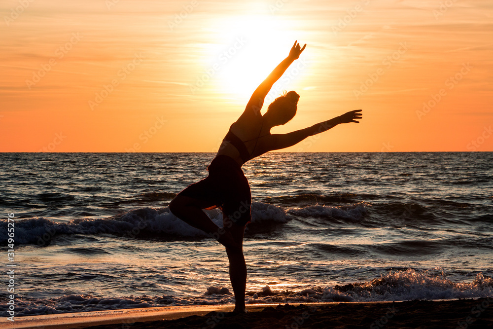 Lonely Dancer ballet posing on the beach sunset silhouette sea