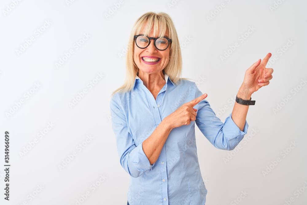 Middle age businesswoman wearing elegant shirt and glasses over isolated white background smiling and looking at the camera pointing with two hands and fingers to the side. Middle age businesswoman wearing elegant shirt and glasses over isolated white background smiling and looking at the camera pointing with two hands and fingers to the side.