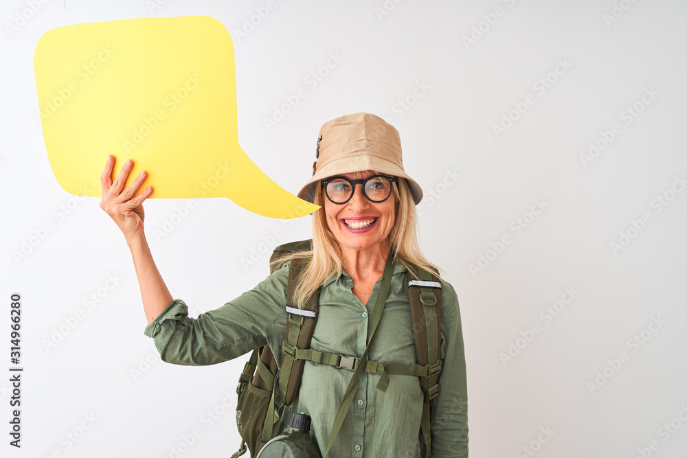 Senior hiker woman wearing canteen holding speech bubble over isolated white background with a happy face standing and smiling with a confident smile showing teeth Senior hiker woman wearing canteen holding speech bubble over isolated white background with a happy face standing and smiling with a confident smile showing teeth