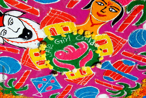  View of Rangoli drawn on floor during Indian Hindu festival Pongal or makar Sankranti, usually in front of home or temple 