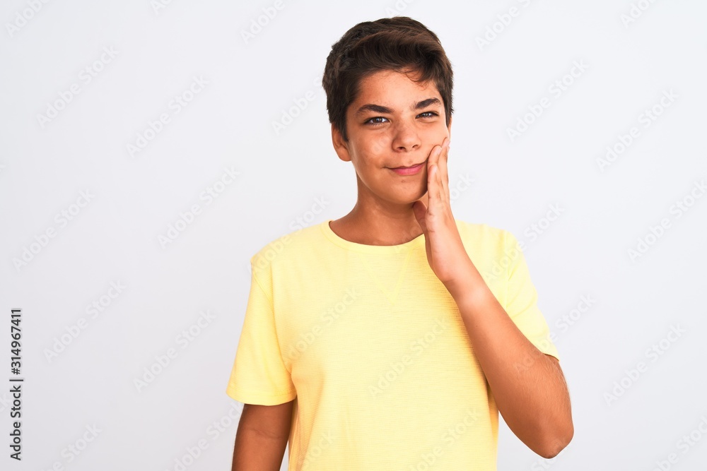 Handsome teenager boy standing over white isolated background touching mouth with hand with painful expression because of toothache or dental illness on teeth. Dentist concept. Handsome teenager boy standing over white isolated background touching mouth with hand with painful expression because of toothache or dental illness on teeth. Dentist concept.