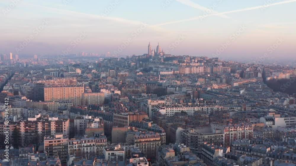 Aerial view of paris Montmartre Sacred heart France sunset pollution in the sky rooftops Aerial view of paris Montmartre Sacred heart France sunset pollution in the sky rooftops