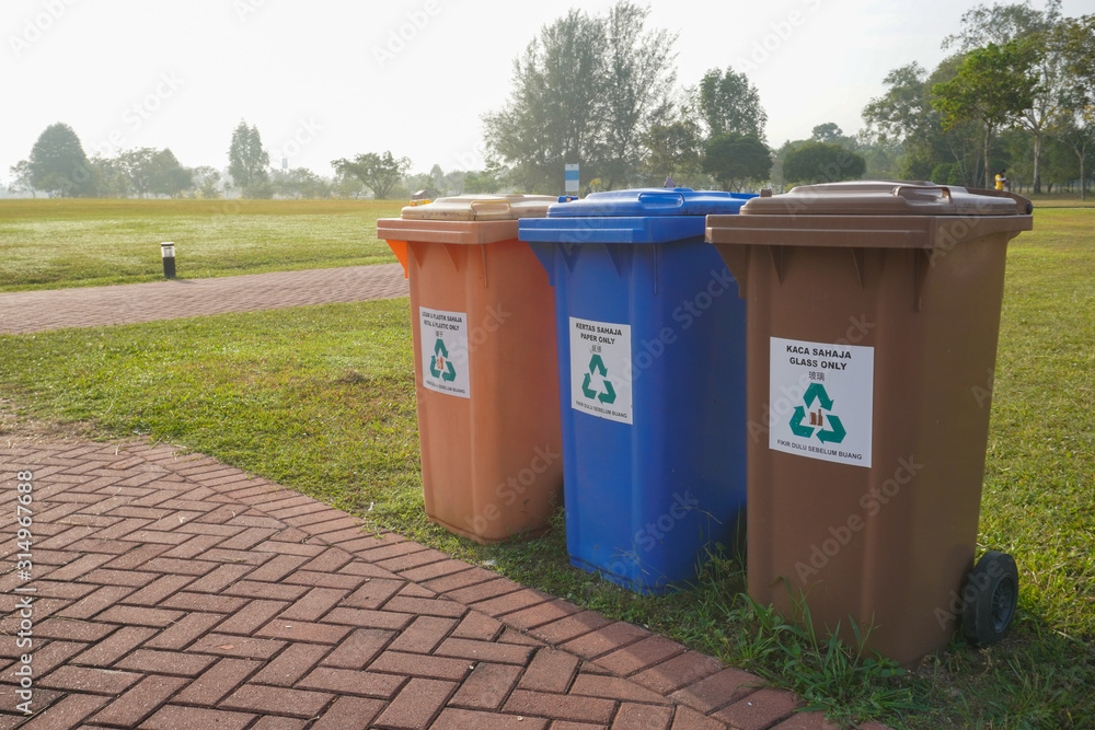 Different colors of recycle bin at public park. Different colors of recycle bin at public park.