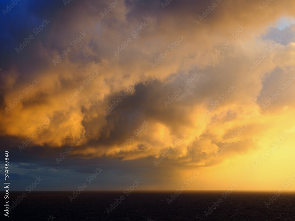 Storm Front Into Sunrise Over Ocean