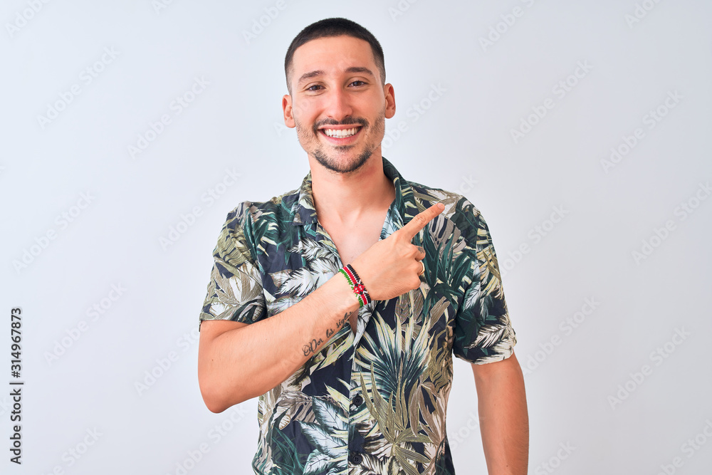 custom made wallpaper toronto digitalYoung handsome man wearing Hawaiian summer shirt over isolated background cheerful with a smile of face pointing with hand and finger up to the side with happy and natural expression on face
