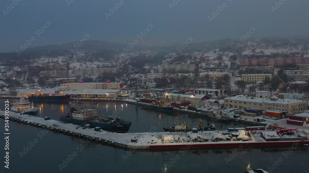 Early in the morning at dawn in the fog, the ships are in port, video from the quadrocopter Early in the morning at dawn in the fog, the ships are in port, video from the quadrocopter