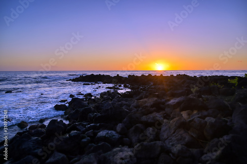Sunset over the coast of Kauai, Hawaii. © Jbyard