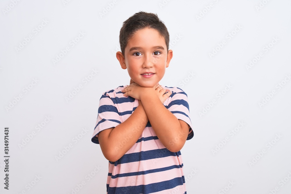 Beautiful kid boy wearing casual striped t-shirt standing over isolated white background shouting and suffocate because painful strangle. Health problem. Asphyxiate and suicide concept. Beautiful kid boy wearing casual striped t-shirt standing over isolated white background shouting and suffocate because painful strangle. Health problem. Asphyxiate and suicide concept.