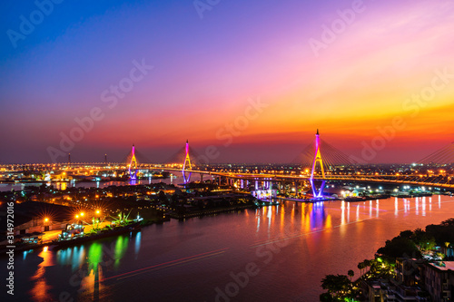 Bhumibol suspension bridge over Chao Phraya River at sunset in Bangkok city, Thailand