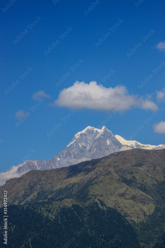 Snow-covered Mountain With Blue Sky, Cloud and Fog Snow-covered Mountain With Blue Sky, Cloud and Fog