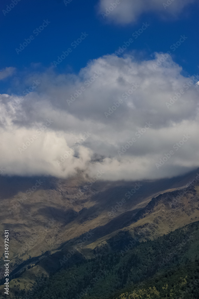 Snow-covered Mountain With Blue Sky, Cloud and Fog Snow-covered Mountain With Blue Sky, Cloud and Fog