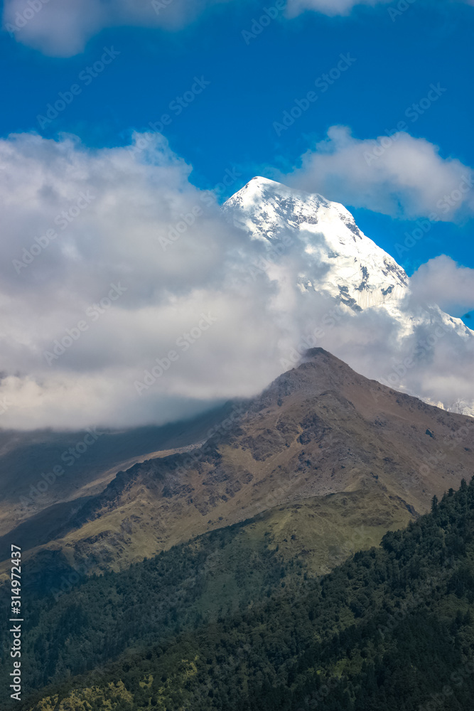 Snow-covered Mountain With Blue Sky, Cloud and Fog Snow-covered Mountain With Blue Sky, Cloud and Fog