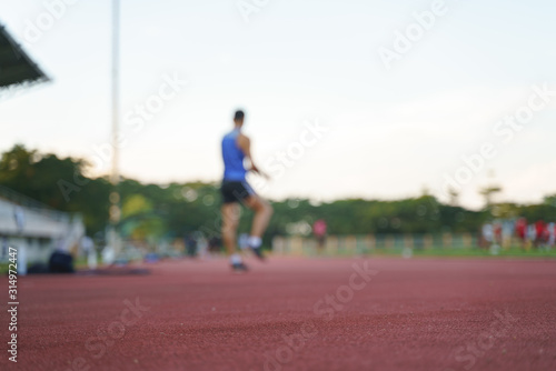 Athlete running along a horizontal track