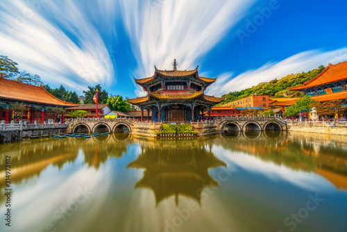Yuantong Temple refletion with waterfront, Kunming capital city of Yunnan, China, travel and tourism,famous place and landmark, religion and traditional concept photo