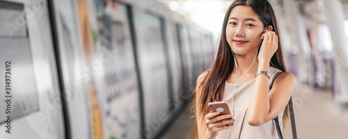 Photography Banner, web page or cover template of Young Asian woman passenger using and list