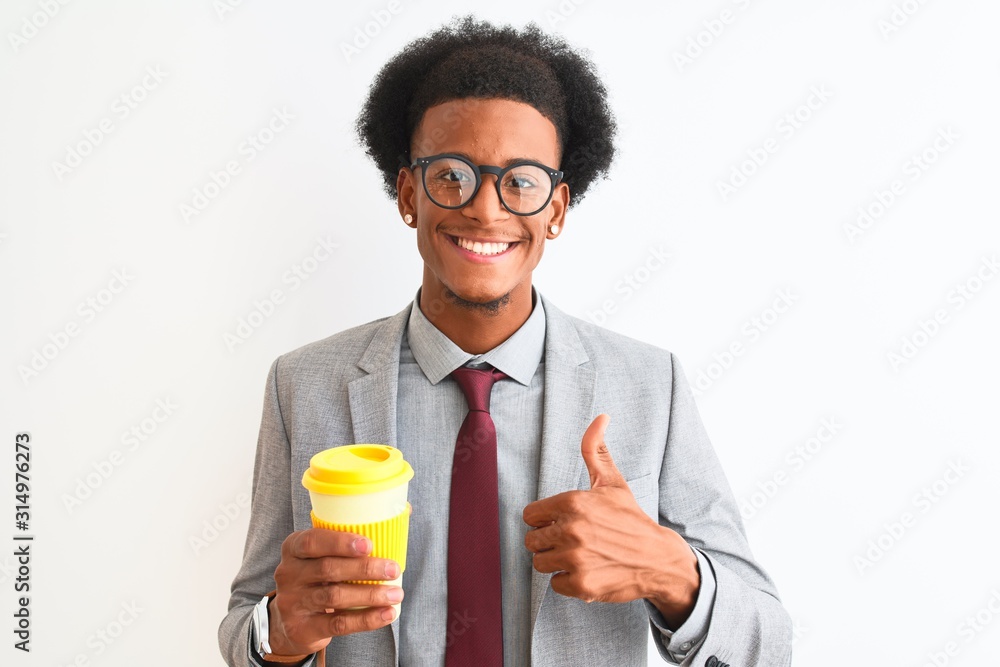African american businessman drinking cup of coffee over isolated white background happy with big smile doing ok sign, thumb up with fingers, excellent sign African american businessman drinking cup of coffee over isolated white background happy with big smile doing ok sign, thumb up with fingers, excellent sign