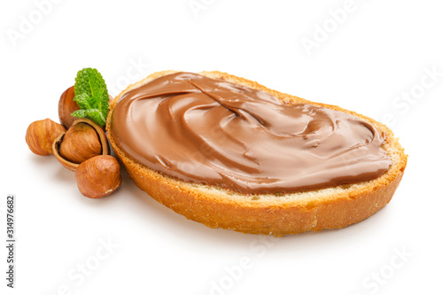 Obraz na plátně Fresh bread with chocolate paste on white background