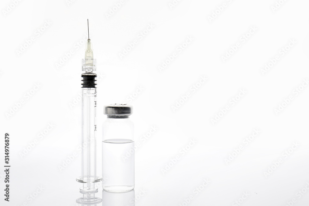Syringe and ampule with filler for cosmetology on white background Syringe and ampule with filler for cosmetology on white background