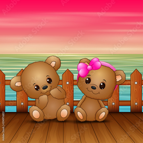 Cute couple a teddy bear sitting on seaport