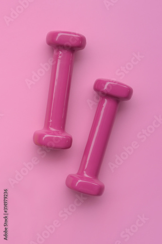close up of dumbbell on pink background © thananya_k