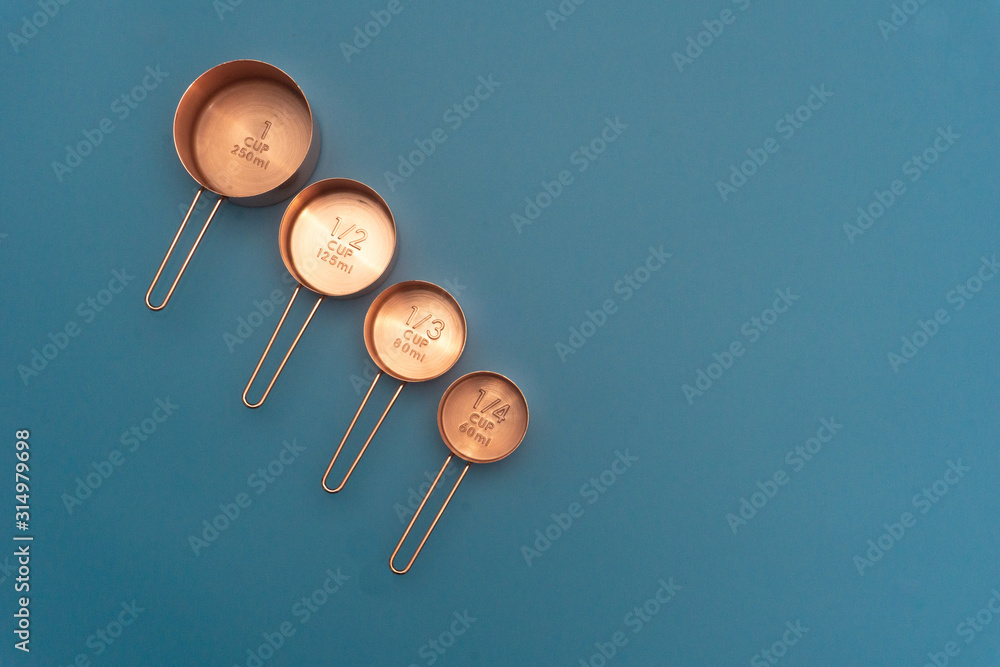 Gold measurement tools on a blue background shot from above Gold measurement tools on a blue background shot from above