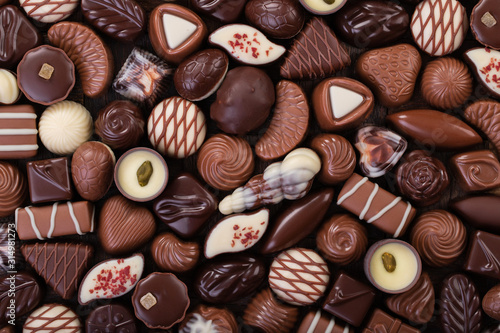 mix chocolate candy, sweet snack, food background.