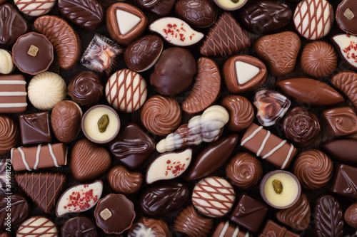 mix chocolate candy, sweet snack, food background.