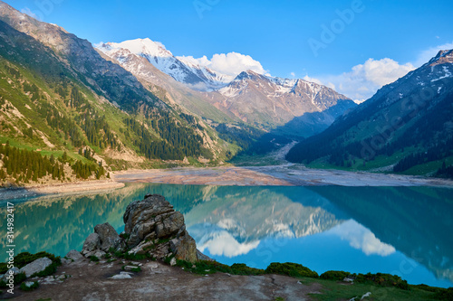 Fototapeta Naklejka Na Ścianę i Meble -  Big Almaty lake in the mountains.  Blurred water effect.  Ile-Alatau National Park.  Kazakhstan.