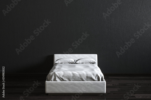 Fototapeta Naklejka Na Ścianę i Meble -  White bed in front of black wall.