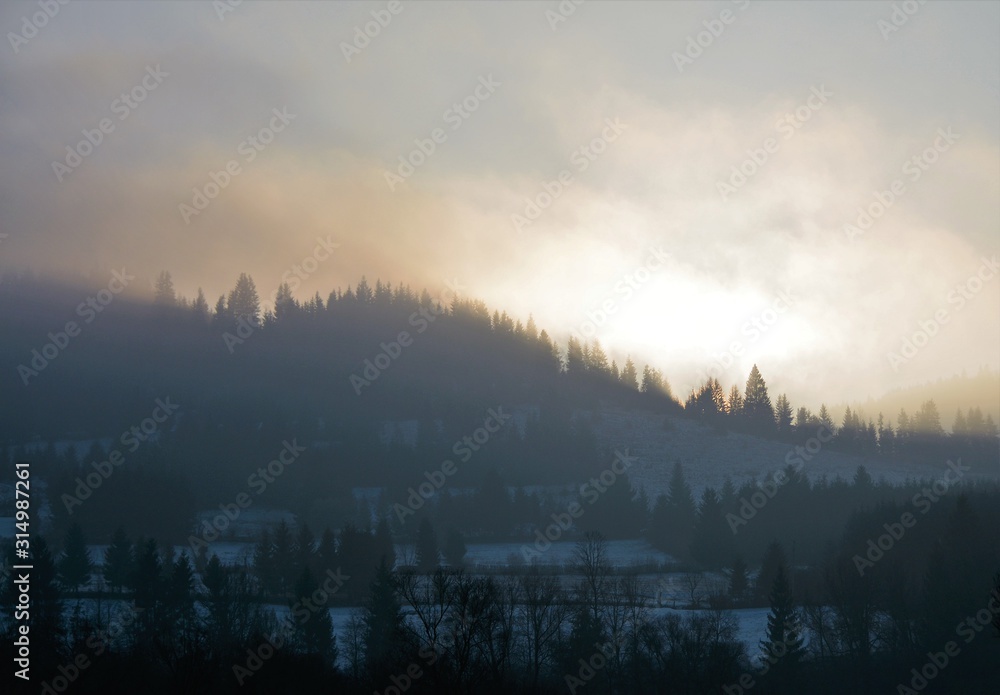 evening light with fog on the mountains