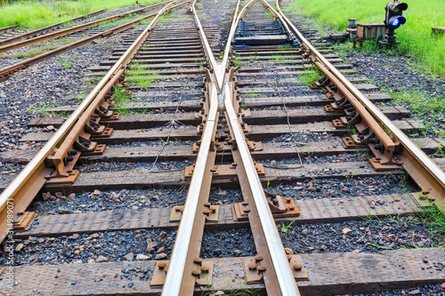 Close up low down view of railway train transport metal steel rails.