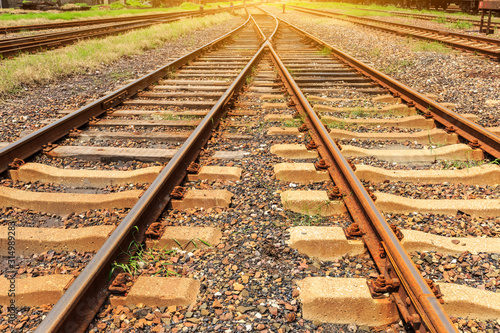 Close up low down view of railway train transport metal steel rails.