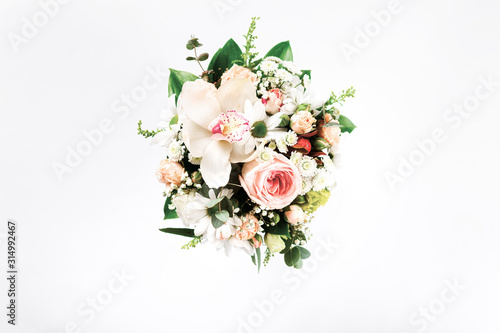 Fototapeta Naklejka Na Ścianę i Meble -  Valentine's Day or Mother's Day concept. Flower bouquet on white background. Flat lay, top view floral composition