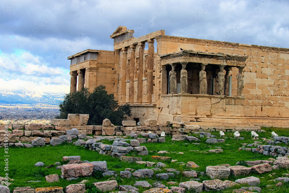 Scenic view of ancient ruins of The Erechtheion or Erechtheum. It is an ancient Greek temple on the north side of the Acropolis of Athens in Greece which was dedicated to both Athena and Poseidon
