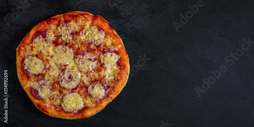 salami pizza with cheese (dough, tomato sauce and other ingredients) menu concept. food background. top view. copy space