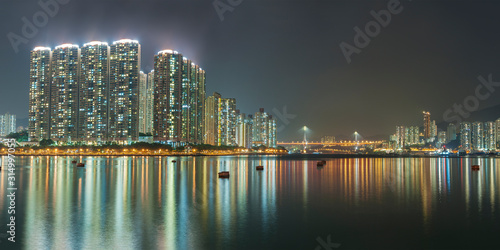 Panorama of harbor of Hong Kong city at night