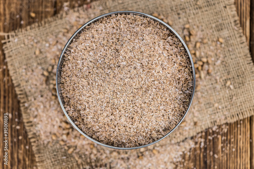 Portion of healthy Wheat Bran (selective focus; close-up shot) photo