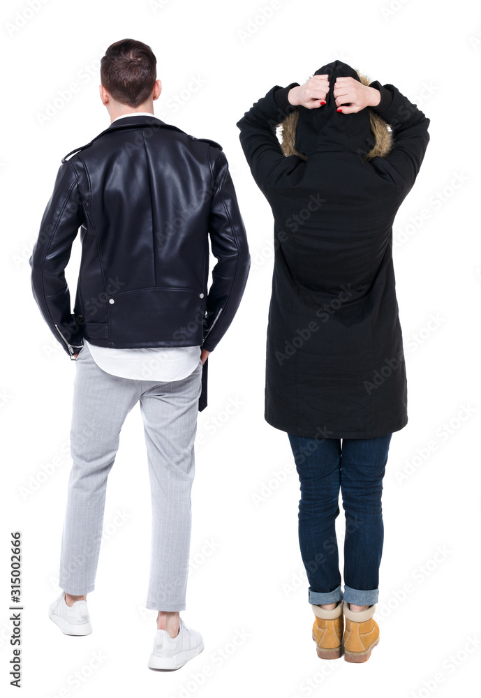 Back view of couple in winter jacket. Back view of couple in winter jacket.