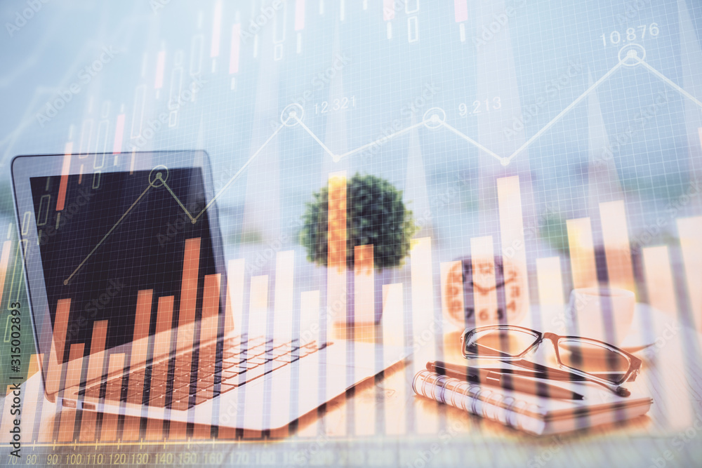Stock market graph on background with desk and personal computer. Multi exposure. Concept of financial analysis. Stock market graph on background with desk and personal computer. Multi exposure. Concept of financial analysis.