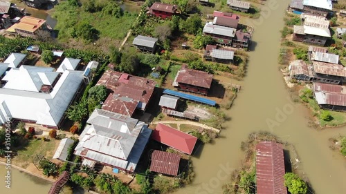 Shift from vertical shot to overview of  village on the famous Inle Lake in Myanmar photo